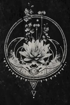 a black and white photo of a flower on a dark background with an inverted design in the center