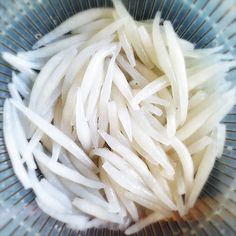 some white food is in a blue bowl