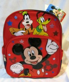 WALT DISNEY MICKEY MOUSE,PLUTO, AND GOOFY 12" BACKPACK WITH TWO MAIN COMPARTMENTS AND SIDE POCKETS! BRAND NEW WITH TAGS!!  Backpack features TWO main compartment with zip closure and adjustable padded shoulder straps. Smaller tack compartment on right side for your calculator,cellular phone,erasers,pencils,pens,etc. Smaller mesh compartment on the left side for your water bottle,powerade,soda can,etc. Backpacks measures approx. on two Large 12" H x 10" W x 4" D Artwork: Popup 3D Applique  » Trad