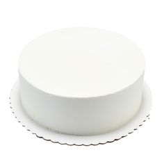 a white cake plate with scalloped edge