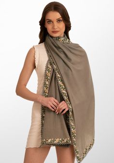 This classic natural scarf is woven from a luxurios wool and silk blend. It features a striking multi-color embroidery appliquŽ border that is further enveloped with a fine natural lace detailing. The embroidery adds a touch of sophistication whilst the exquisite lace detailing makes this scarf a must-have accessory for the fashion-forward individual. Wrap yourself in style and make a bold fashion statement with this versatile scarf that seamlessly blends warmth with artistic flair. Luxury Elegant Scarves With Intricate Embroidery, Luxury Bohemian Scarves With Resham Embroidery, Luxury Elegant Scarves With Embroidered Border, Bohemian Scarf With Embroidered Border, Bohemian Embroidered Pashmina Scarf, Multicolor Embroidery, Color Embroidery, Lace Border, Fall Collections