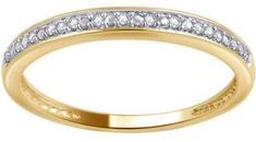 a yellow gold wedding band with white diamonds