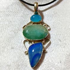 This Is A Gorgeous, Handmade, Amazonite, Blue Lace Agate, And Chalcedony Pendant Necklace. This Piece Of Silvery Jewelry Is Gorgeous And I Really Debated Keeping This One! I Love It! The Pendant Measures Approximately 2"X 1". The Pendant Comes With A Black Corded Necklace With An Extension. I Hope You Like It. Thanks For Stopping By And Feel Free To Leave Me A Fair Offer. :) Adjustable Blue Agate Necklace, Adjustable Blue Agate Necklaces, Blue Agate Gemstone Necklaces, Blue Agate Gemstone Necklace, Blue Chalcedony Jewelry With Natural Stones, Blue Agate Pendant Jewelry, Blue Agate Necklace Gift, Blue Agate Necklace For Gift, Unique Blue Agate Jewelry