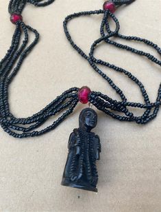 This is BONE and not plastic, it will pass on to generations. Unbreakable Hand carved pendant in deer bone with Glass Esu Necklace. Ties That Bind, Bone Pendant, Bone Carving, Tassel Necklace, Bones, Hand Carved, Glass Beads, Beaded Necklace, Etsy Gift Card