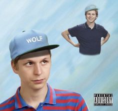 a young man wearing a blue hat with the word wolf on it and an image of him