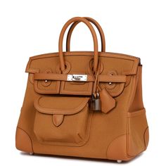 This rare "Cargo" Birkin is of Desert/Sesame swift and toile canvas with palladium hardware and features tonal stitching, four outer pockets, front flap, two straps with center toggle closure, clochette with lock and two keys, and double rolled handles. The interior is lined with Desert/Sesame toile and has one zip pocket with an Hermes engraved zipper pull and an open pocket on the opposite side. Payment for this item is by Bank Wire only unless other arrangements have been made. Collection: Z Origin: France Condition: Pristine; new or never (Plastic on hardware) Accompanied by: Hermes box, Hermes dustbag, clochette, lock, two keys, clochette dustbag, rainhat, ribbon and felt Measurements: 10" width x 7.5" height x 4.75" depth; 2.75" handle drop Delivery 5-8 or 10-15 working days Please n Cargo Birkin, Hermes Box, Birkin 25, Hermes Birkin, Myanmar, Missoni, Brunei, Womens Backpack, Christian Dior