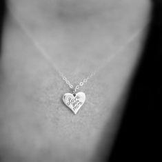 "sterling silver love you more necklace - A small solid sterling silver heart pendant, measuring just under 5/8\" (14 mm) across, 1/2\" (13 mm) down, a nice 16 gauge thick (1.2 mm). - Words are etched, so they are perfectly aligned. Details blackened (oxidized) to stand out. - Necklace is 1.5 mm sterling silver cable chain, length customizable at drop down menu. High quality lobster clasp and locking jump rings, all solid sterling silver. - Smooth on back, with a tiny 925 mark on back. - Package Sterling Silver Heart Charm Necklace, Meaningful Silver Heart Charm Necklaces, Meaningful Heart Shaped Silver Charm Necklace, Meaningful Silver Heart Charm Necklace, Meaningful Sterling Silver Charm Necklace For Valentine's Day, Sterling Silver Hand Stamped Heart Necklace, Sterling Silver Hand Stamped Heart Pendant Necklace, Hand Stamped Sterling Silver Heart Pendant Necklace, Sterling Silver Hand Stamped Heart Charm Necklace