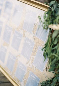 a map is hanging on the wall with greenery