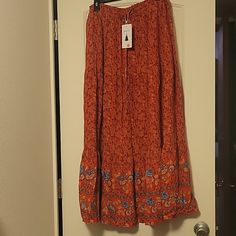 This Skirt Is A Long Maxi Style With A Beautiful Pattern On The Bottom. Brand New Never Worn. Red Flared Maxi Skirt For Beach, Red Maxi Skirt With Elastic Waistband For Beach, Red Flared Maxi Skirt For The Beach, Red Midi Skirt For Beach, Red Tiered Maxi Skirt With Elastic Waistband, Red Lined Skirt For Beach, Red Lined Beach Skirt, Red Beach Midi Skirt, Red Lined Skirt For The Beach