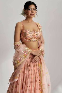 This lehenga set is perfect for a glamorous wedding ceremony, as it exudes elegance and grace. The vibrant colors and shimmering sequins make it a statement piece that will surely turn heads and leave a lasting impression. Be prepared to steal the spotlight and make a memorable entrance in the ruah gathered lehenga set. Its beautiful craftsmanship, intricate details and vibrant colors will make you feel like a queen on your special day. Traditional Pink Palazzo Set With Sequins, Traditional Pink Sequined Palazzo Set, Sequined Semi-stitched Palazzo Set For Festivals, Traditional Palazzo Set With Sequins For Reception, Traditional Sequin Palazzo Set For Reception, Pink Bollywood Palazzo Set With Sequins, Pink Bollywood Sequined Palazzo Set, Diwali Designer Sequined Sharara, Sequin Palazzo Set For Navratri Party