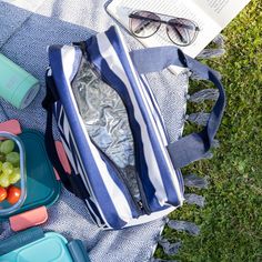 the lunch bag is full of fruit and water, along with other items to eat