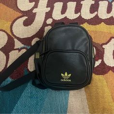 Black Nylon Adidas Small Back Pack. Great For Festivals Or Concerts. Purchased New But Never Used. Streetwear Black Backpack With Zipper Pocket, Black Backpack With Zipper Pocket For Streetwear, Black Nylon Shoulder Bag For Back To School, Black Streetwear Bag For Back To School, Adidas Nylon Backpack For Everyday, Black Backpack With Zipper For Streetwear, Black Backpack With Zipper Closure For Streetwear, Black Nylon Crossbody Backpack, Trendy Adidas Backpack