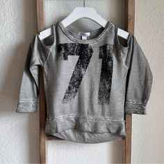 Brand New, Never Worn Super Cute Grey/Black Cold Shoulder Long Sleeved Top By Xhilaration Sz: 4/5 Girls Graphic Print Tops For Playwear In Fall, Trendy Gray Distressed Tops, Trendy Distressed Gray Tops, Distressed Gray Tops For Fall, Winter Letter Print Top For Playwear, Winter Tops With Letter Print For Playwear, Fall Playwear Crew Neck Tops, Crew Neck Tops For Playwear In Fall, Crew Neck Tops For Fall Playwear