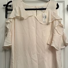 Beautiful Cream Cold Shoulder Blouse Large Orders Received Before 1 Pm Mon-Fri Will Be Shipped Same Day! Thanks For Taking Time To Look At My Closet Have A Great Day! Elegant Off White Short Sleeve Top, Chic Flowy Cream Tops, Elegant Flowy Tops For Summer, Chic White Summer Blouse, Chic Off-white Short Sleeve Blouse, Chic White Blouse For Summer, Chic Off White Short Sleeve Blouse, Chic Off-white Sleeveless Blouse, Cream Summer Blouse For Brunch