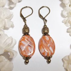 This Stunning Bohemian Beaded Earring Set Is Brand New & Handmade By Me. Done With Bumpy And Dented Mother Of Pearl White, Cream, Orange, And Brown Beads. The Pair Also Have Rustic Antiqued Bronze Toned Costume Jewelry Beads. They Dangle & Drop From Lever Backs For Women's Pierced Ears. 2 1/8 Inches Tall & 1/2 Inch Wide. Each Single Earring Weighs 3.7 Grams. You Will Absolutely Love The Color Combination On These. A Match Made In Heaven! Funky Unique Bold Dangly Dangling Bead Fashion Accessory H Bead Fashion, Fancy Dress Up, Beaded Earring, Elegant Sophisticated, A Match Made In Heaven, Match Made In Heaven, Jewelry Beads, Made In Heaven, Classy Chic