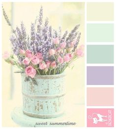 a vase filled with lots of pink flowers on top of a white table next to a color swatch