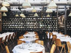 an empty restaurant with many tables and chairs