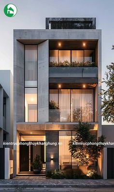 an apartment building with plants growing on the balconies