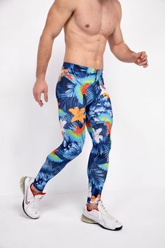 Description: Blue Jungle Print Men's Leggings Breathable & Moisture Wicking 4-Way Stretch Fabric Machine Wash Cold, Quick Drying High Stretch Nylon / Spandex Bolt Logo Patch This design does not have pockets Model is 6’2’’ (189cm) tall, 34’’ (86cm) waist and wears size Large. Blue 4-way Stretch Bottoms For Outdoor, Blue Stretch Pants For Outdoor, Blue Sportswear Pants For Running, Blue Compression Pants For Training, Summer Tight Blue Bottoms, Blue 4-way Stretch Running Leggings, Blue 4-way Stretch Leggings For Running, Full-length Blue Running Pants, Casual Blue Running Pants