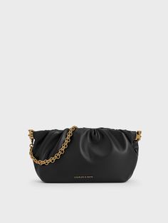 A classic evening bag is a staple in every wardrobe, and the Brigette offers a sophisticated take on that. The elongated silhouette is softened by ruched folds that give it a slouchy appeal. Affixed with a frame closure, you will be able to access your essentials with ease. The versatility of the bag extends beyond its black finish -- it can be carried on the shoulder with the chain strap, slung across the body with the adjustable one, or carried on its own as a clutch. Charles Keith, Jewelry And Accessories, Chain Strap, The Chain, Evening Bags, Clutch Bag, The Bag, The Body, Chain