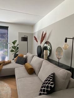 a living room filled with furniture and decor