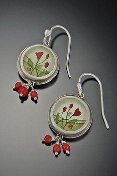 Round Poppy Earrings by Ananda Khalsa. A bright burst of red color wonderfully contrasts sterling silver in both the hand-painted acrylic image and coral beads of these enticing earrings. Artistic Red Jewelry For Jewelry Making, Red Round Enamel Earrings, Red Enamel Round Earrings, Artistic Red Enamel Jewelry, Unique Red Jewelry With Artistic Design, Elegant Red Hand Painted Jewelry, Artisan Red Jewelry With Artistic Design, Red Hand Painted Sterling Silver Jewelry, Red Hand-painted Dangle Earrings