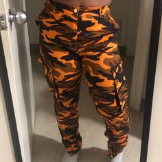 Orange Camouflage Pants. Size Medium. Paid $40. Never Worn, Nwot. At The Bottom Of The Pants, Fit Like Joggers. Buy 4 Or More Items And Receive Free Shipping! Orange Pants For Streetwear In Fall, Orange Camo Pants, Camouflage Military Cargo Pants With Hip Pockets, Spring Military Camouflage Pants, Camouflage Military Cargo Pants, Military Camouflage Cargo Pants With Patch Pockets, Camouflage Pants, Pants Fit, Camo Pants