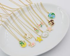 a white plate topped with lots of different necklaces