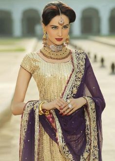 Buy Indian Bridal Wear - Indian Embroidered Bridal Outfit - Indian Wedding Dresses With Zardozi, Dabka, Zari Nagh, Crystals, Sequins in USA, UK, Canada, Australia Visit Now : www.NameerabyFarooq.com or Call / Whatsapp : +1 732-910-5427 Designer Gold Dola Silk Lehenga, Designer Gold Sharara With Zari Work, Unstitched Gold Lehenga With Intricate Embroidery, Gold Sharara With Dupatta For Reception, Gold Lehenga With Mirror Work For Designer Wear, Designer Gold Lehenga With Mirror Work, Gold Lehenga With Mirror Work For Party, Designer Gold Sharara With Mirror Work, Gold Kundan Saree For Reception