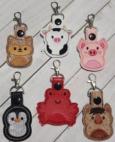 six key fobs with different animals on them