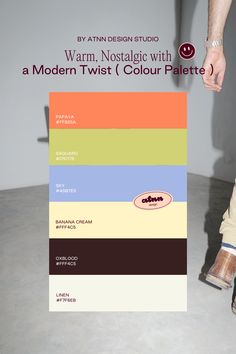 a person standing in front of a poster with different color swatches on it and the words warm, nostalgic with a modern twist colour palette