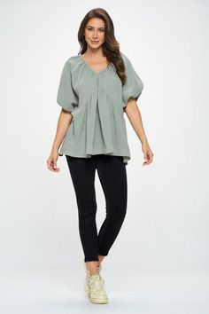 Made in USA Cotton V neck Puff Sleeve Tunic Top. Fabric content: 100% Cotton. Available in other colors. Style: casual, formal Print / Pattern: solids Silhouette: oversized Fit: oversized Neck Line: v neck Sleeve: shortsleeve Lining: no Made In: Made in U.S.AFabric Contents: 100% Cotton.Size Measurement (inch): S: 18.5 (Bust), 21.0 (Waist), 27.0 (Hips), 28.0 (Length) M: 19.5 (Bust), 22.0 (Waist), 28.0 (Hips), 28.5 (Length) L: 20.5 (Bust), 23.0 (Waist), 29.0 (Hips), 29.0 (Length) Trendy Puff Sleeve Top For Spring, Casual Billowy Blouse For Fall, Spring Oversized Blouse In Solid Color, Flowy Solid Color Spring Blouse, Flowy Solid Spring Blouse, Spring Trendy Puff Sleeve Top, Oversized Solid Color Tops For Spring, Trendy Spring Puff Sleeve Top, Casual Billowy Blouse For Spring