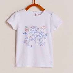 New, With Tag, Never Used This White Delicately Printed T-Shirt Is Perfect For A Day Out In The Sun Or A Play Date With Friends. Compostion: 100% Pima Cotton. Machine Washable. Made In Peru White Organic Cotton Tops For Spring, Playful Organic Cotton Tops For Playwear, Playful Organic Cotton Tops For Playtime, Cute Spring Tops In Organic Cotton, Organic Cotton Crew Neck Top For Playtime, Casual Organic Cotton Crew Neck Top, Organic Cotton Graphic Print Tops For Playtime, Cotton Crew Neck Top For Playtime, Crew Neck Cotton Top For Playtime