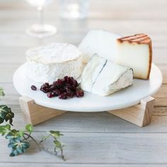 cheese and cranberries on a white plate