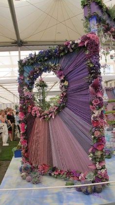 a large purple piece of art sitting on top of a table