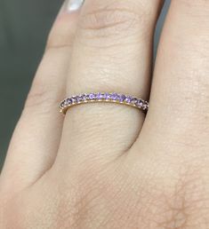 "Delicate Natural Amethyst Gemstone Half Eternity Band Ring. Material: Solid Gold (14K or 18K) Finishing: High Polished/ Shiny Fit: Comfort/ Rounded Interior Width: 1.8 mm Height: 1.8 mm Setting Type: U Micro Pave (reminds letter \"U\") Stone: Natural Amethyst Shape & Cut: Round, Diamond Cut Stone Size: 1.5+ mm Total Carat Size: apx 0.30+ ct Quantity of Stones: apx 19 (varies by ring size) Quality: AAA This kind of Bands are called Round Wire Eternity Bands. These Rings are Full of Elegance Amethyst Halo Rings For Promise, Purple Sapphire Birthstone Ring With Diamonds, Purple Sapphire Ring With Diamond Birthstone, Purple Amethyst Gemstones With Prong Setting, Purple Sapphire Ring With Diamond, Yellow Gold Amethyst Ring With Prong Setting For Promise, Purple Diamond Halo Ring, Fine Jewelry Purple Halo Jewelry, Purple Amethyst Halo Ring For Promise