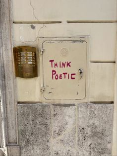 a sign on the side of a building that says think petic