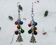 Handmade Earrings with adorable colorful bells and Christmas. The perfect gift for anyone Bell Drop Earrings As Gift, Bell Drop Earrings For Gifts, Multicolor Holiday Dangle Earrings, Multicolor Dangle Earrings For Holiday, Holiday Multicolor Earrings As A Gift, Holiday Multicolor Earrings Perfect For Gifts, Holiday Multicolor Earrings As Gift, Multicolor Earrings For Holiday Gifts, Multicolor Christmas Earrings