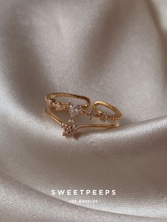 Product Details + Care - 18K Gold Dipped Over Brass - Brass: Copper + Zinc Alloy - 1 Ring - Wipe Clean - Imported Dimensions - Size is adjustable Have a question? Please message info@shopsweetpeeps.com and our support team will get back to you in 48 hours. Gold Adjustable Rings For Proposal, Dainty Gold Jewelry For Proposal, Gold Dainty Heart Ring For Proposal, Gold Heart Open Ring For Proposal, Dainty Gold Heart Ring For Proposal, Delicate Gold Jewelry For Proposal, Delicate Gold Heart Open Ring, Delicate Gold Heart Shaped Open Ring, Dainty Gold Necklace