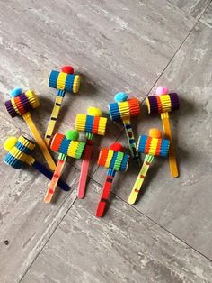 several colorful toothbrushes are arranged on the floor