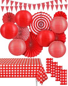 some red and white paper decorations on a table