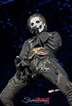 a man in black and white makeup on stage