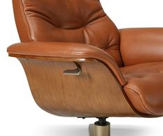 a brown leather recliner chair sitting on top of a metal base