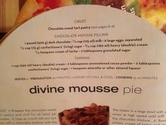 a close up of a menu with different types of desserts in the back ground