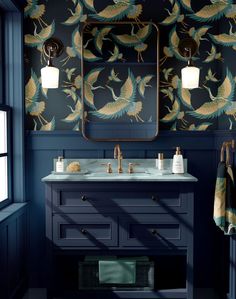 a bathroom with blue walls and gold accents