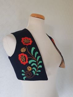 This is an antique traditional Norwegian bunad (Norwegian folk costume) bodice top or vest . It is most likely from the Telemark region and I think it is made between 1880 and 1920s. The bodice has been made with a black wool fabric and has been embroidered with beautiful floral rosemaling pattern . It is lined with a shiny patterned beige cotton(?). It is handmade and partially hand sewn. It is small and probably made for a child. The fabric is sturdy and it can be worn. It has  a tiny hole in Norwegian Folk Costume, Traditional Norwegian Clothing, Folk Vest, Norwegian Clothing, Rosemaling Pattern, Bodice Top, Lace Collar, Folk Costume, Vest Outfits