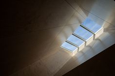 the skylight shines brightly in an empty room with no one inside or outside