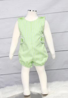 He will look amazing in baby boy clothes by Zuli Kids.  Baby shortall is green and white stripe with side tabs and decorative buttons. Available plain or with monogram. *Zuli Kids Premium Quality *65% cotton 35% Poly *Machine Wash Gentle *Shoulder Button Closures *Snaps in Crotch for Easy Diaper Change on sizes 24 Mo and smaller *Short or Long Pants *Available in Sz NB - 2T WHATS INCLUDED One piece romper in your choice of design options.  MATCHING SHIRT AVAILABLE HERE: https://www.etsy.com/list Green Bubble Romper For Spring Playwear, Green Bubble Romper For Summer Playwear, Spring Green Bubble Romper For Playwear, Green Playful Bubble Romper For Playwear, Cute Green Bubble Romper For Playtime, Green Summer Bubble Romper For Playtime, Green Playful Bubble Romper For Playtime, Cute Green Cotton Bubble Romper, Green Sleeveless Playful Bubble Romper