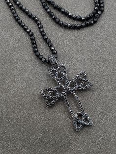 Wonderful, 925 Sterling Silver Black Spinel Gothic Style Celtic Cross Pendant with Beaded Necklace.  This beautiful necklace is sure to receive many compliments!  SOLID 925 STERLING SILVER, FULLY TESTED, NOT PLATED OR FILLED.  Length: 23.5"  Width: 2.4mm  Gemstone: Black Spinel  Weight: 10.1 Grams  Hallmarked: 9258 / CN / FZN  We gladly combine shipping!  Everything is packed with care to make sure it arrives safely.  We only sell authentic items. If it is a name brand item, we guarantee it to be authentic.  If it is made of precious metals and or gemstones, we guarantee it to be as described.  Please check our feedback and buy with confidence.  We work very hard to make sure you are happy doing business with us, and we appreciate your positive feedback very much!  Please email us with any Silver Cross Jewelry With Black Beads, Silver Beaded Cross Pendant Necklace, Cross-shaped Faceted Beads For Jewelry Making, Black Faceted Bead Pendant Jewelry, Celtic Cross, Black Spinel, Gothic Style, Beautiful Necklace, Gothic Fashion