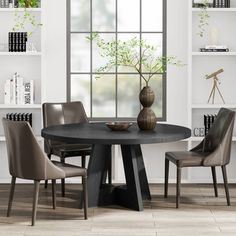 a dining table with chairs around it in front of a window and bookshelves